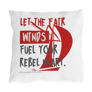 Sailing outdoor pillow with red sail graphic and “Let the Fair Winds Fuel Your Rebel Heart” text